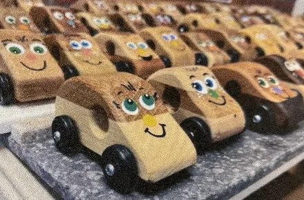 The same cars finished, with painted faces and black wheels.